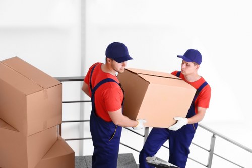 Flat removals team planning a move on a Bayswater residential street