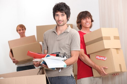Moving truck and packed boxes outside a Bayswater residential building