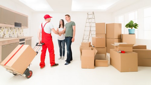 Team unloading boxes and furniture at a Bayswater property